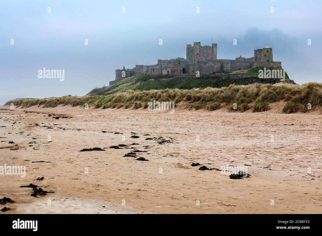 bamburgh-castle-northumberland-england-uk-across-the-dunes-stock