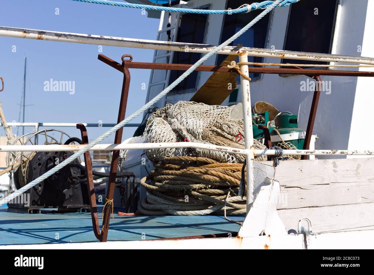 https://c8.alamy.com/comp/2C8C073/a-fishing-boat-with-a-lot-of-fishing-items-on-board-pesaro-italy-europe-2C8C073.jpg
