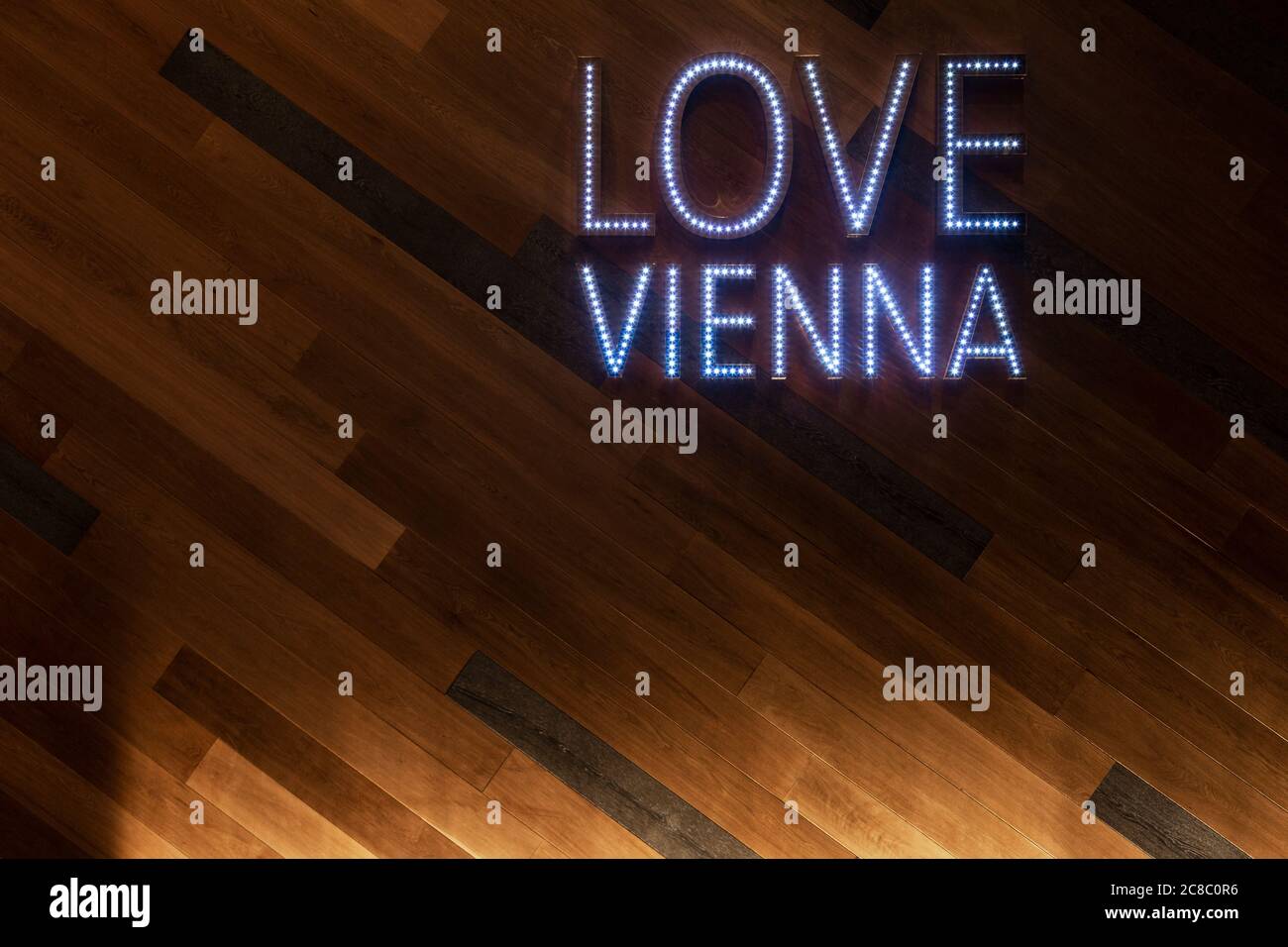 'Love Vienna' words in neon lighting on a foyer wall Stock Photo