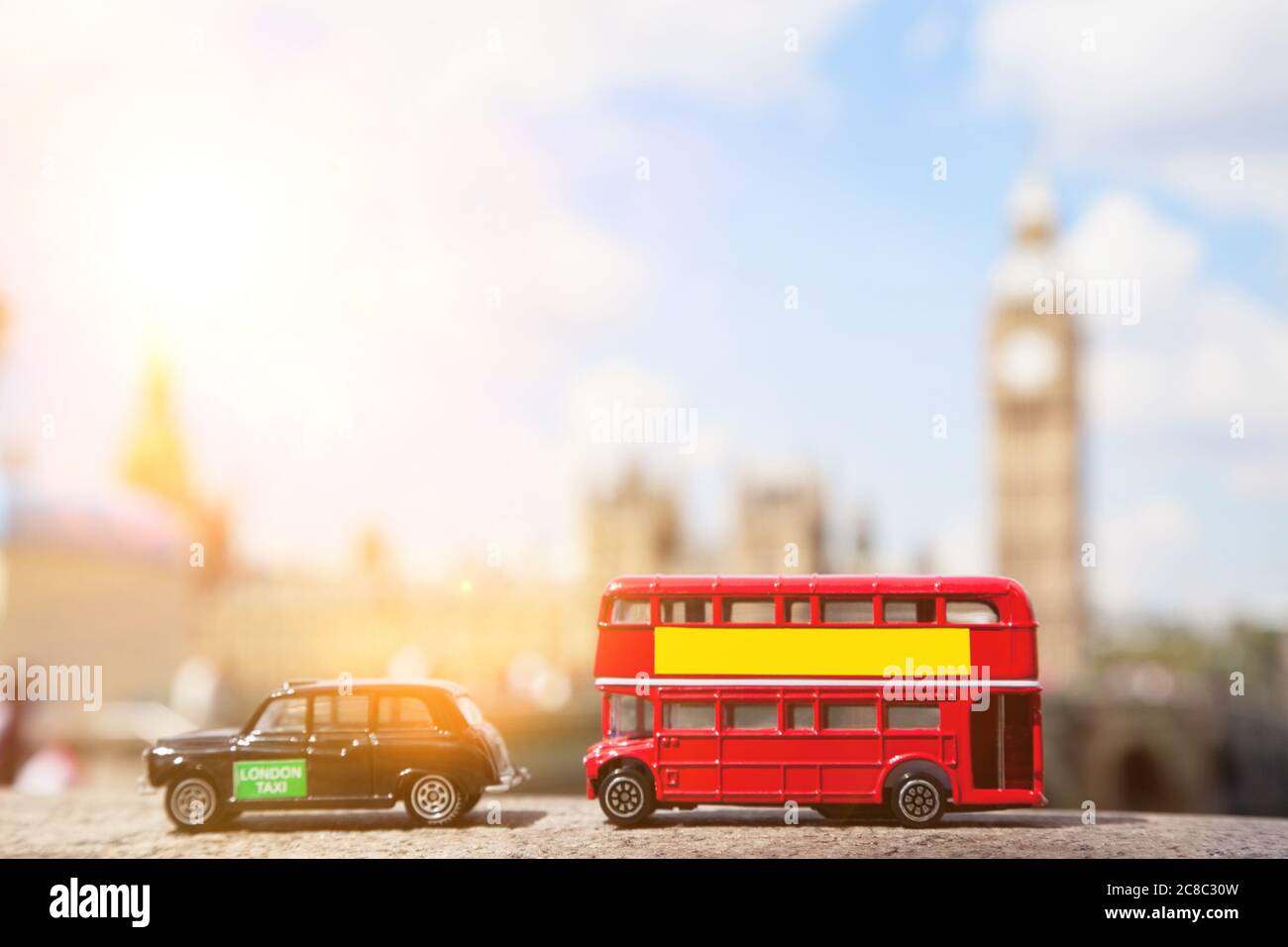 Close-up view of public transport figurines with Big Ben in the background Stock Photo