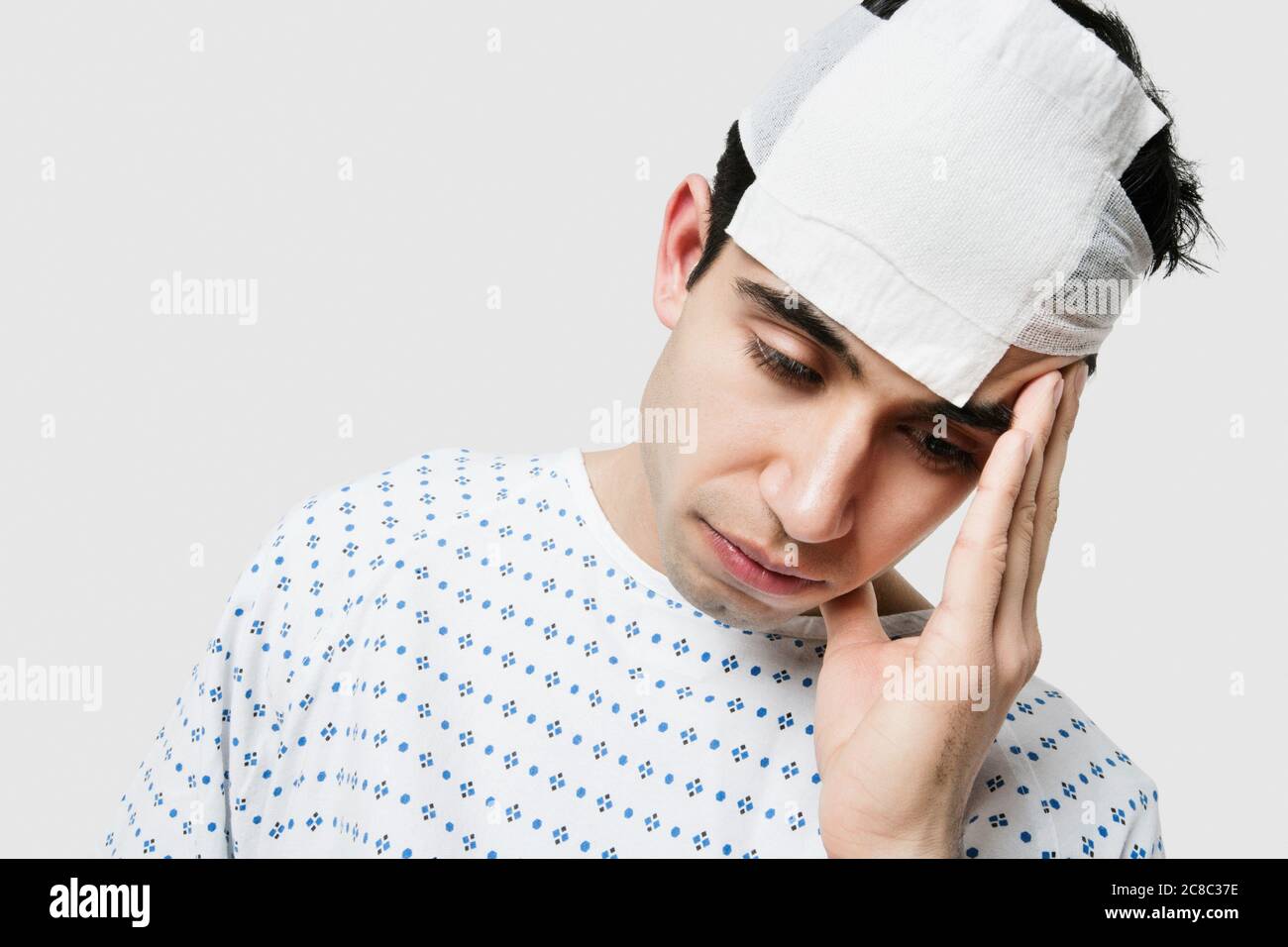 Indian male patient in hospital feeling sick Stock Photo