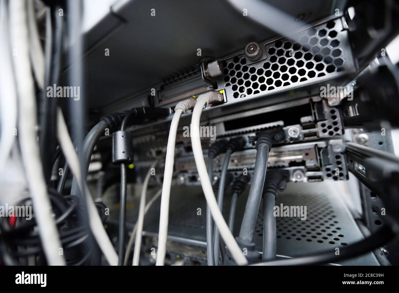 Close-up of data cable plug connected to servers in computer lab Stock ...