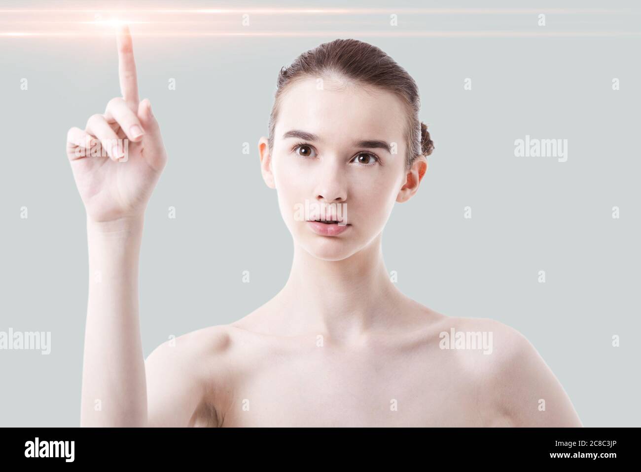 Attractive caucasian woman touching interactive screen Stock Photo