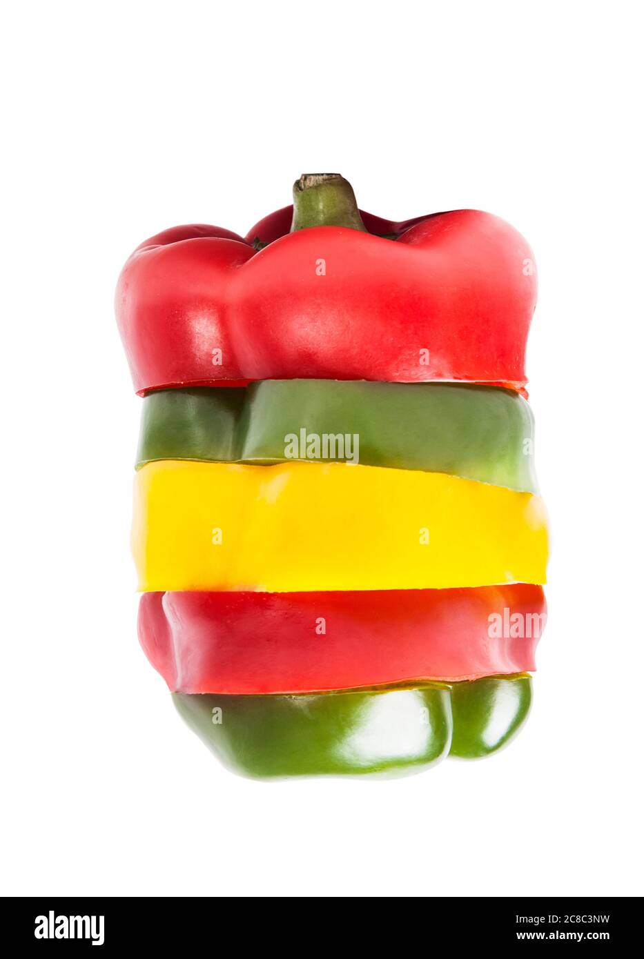 Slices of yellow green and red peppers making up one large pepper Stock Photo