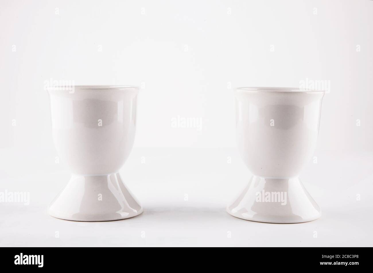 Two white egg cups Stock Photo