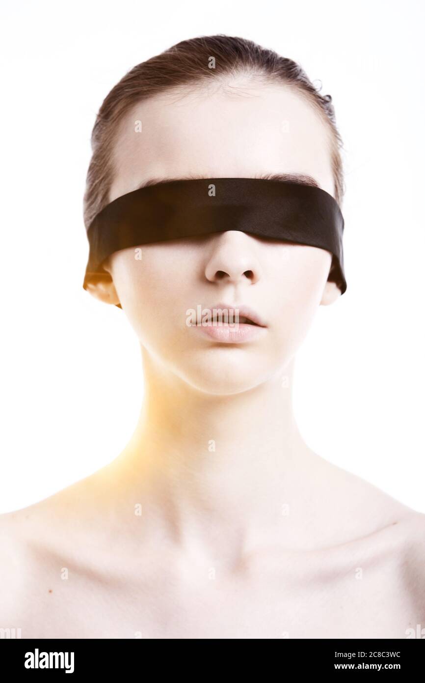 Caucasian woman wearing blindfold Stock Photo