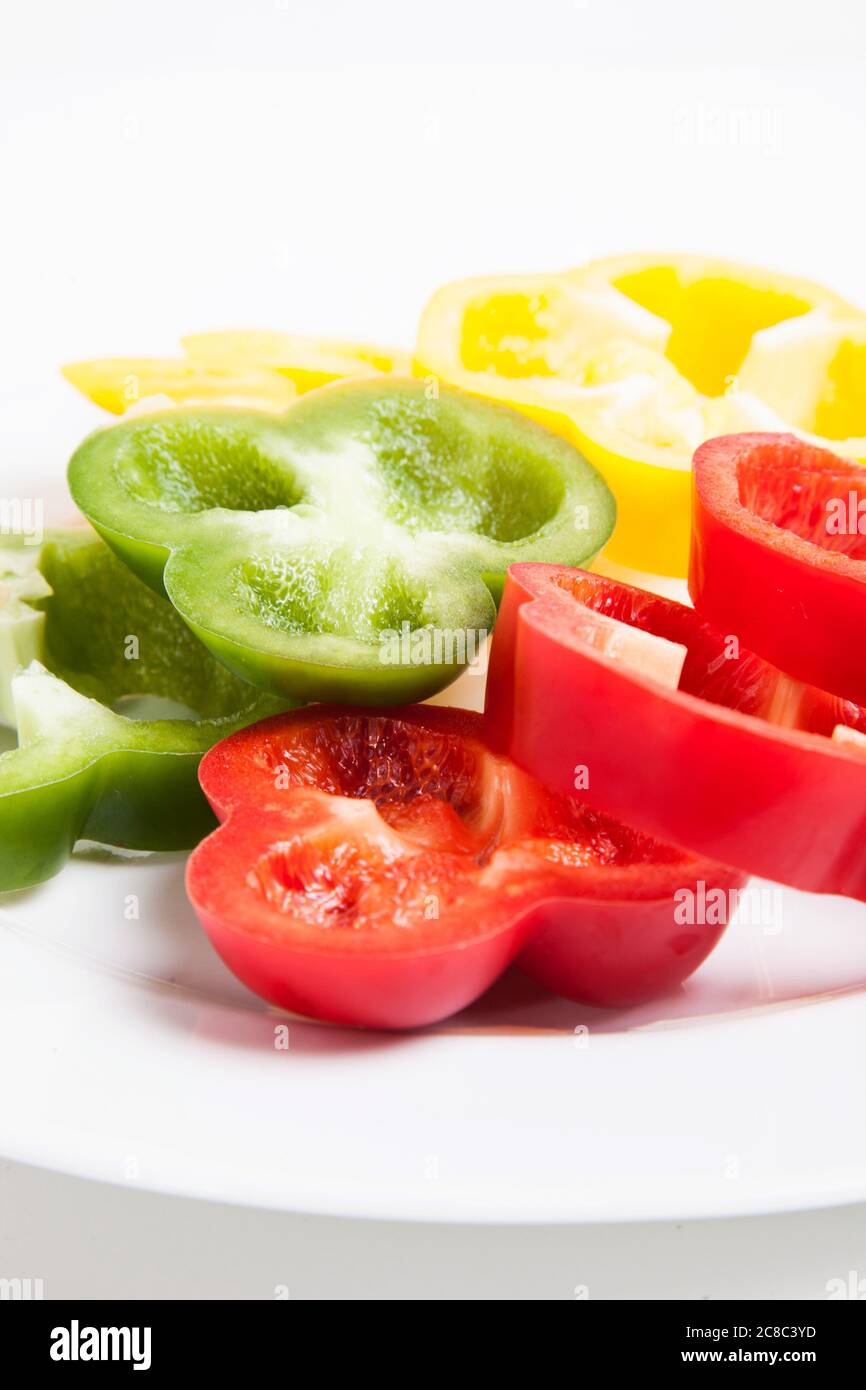 Sliced Green Red and Yelloe Peppers Stock Photo