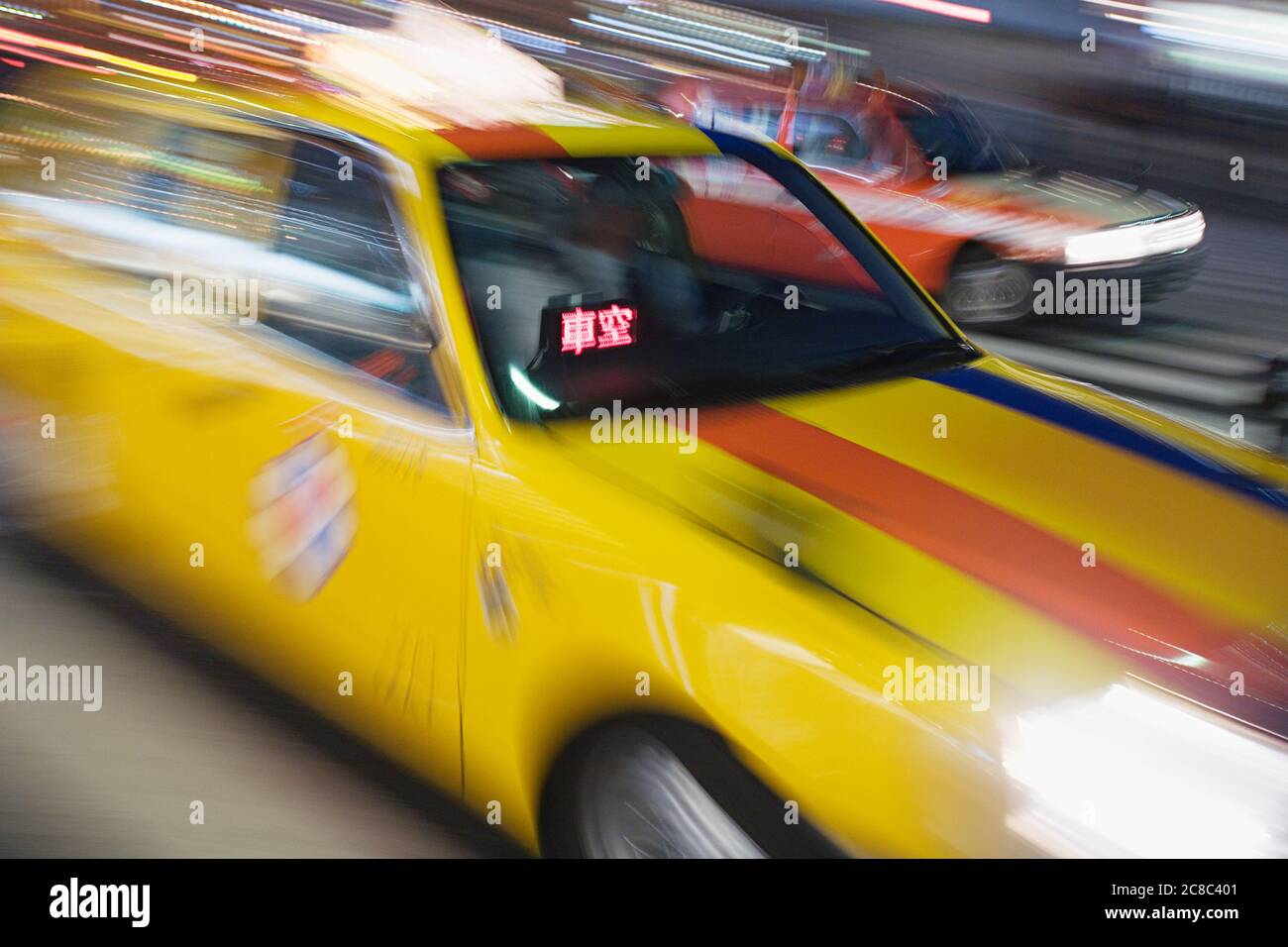 Japanese yellow taxi blur Stock Photo