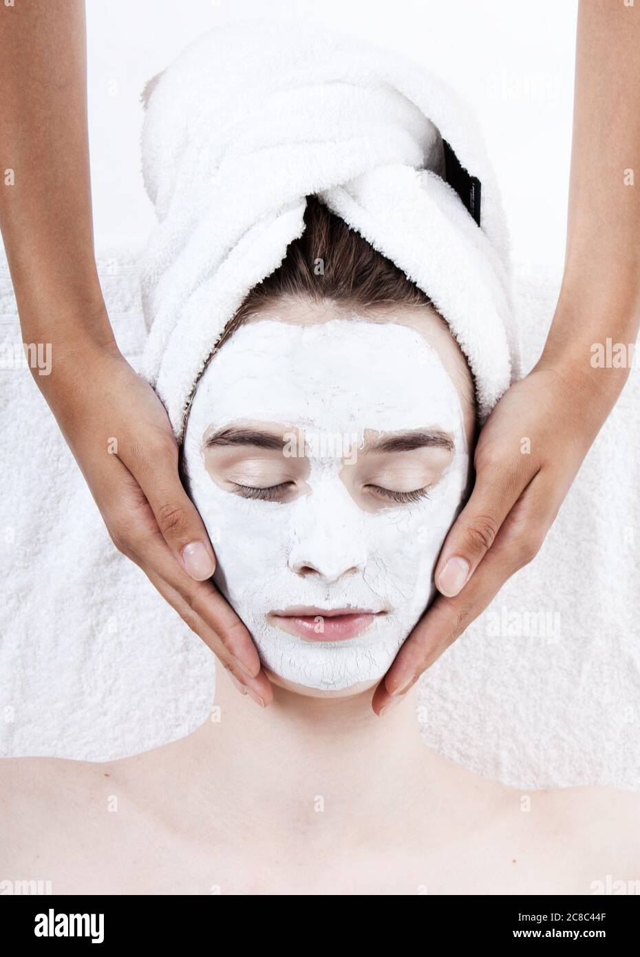 Female having face rub mask in spa Stock Photo