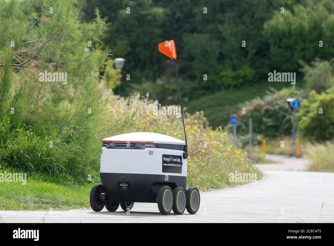 A Starship robot sets off from a Co-op store in Milton Keynes during a visit by Labour leader Keir Starmer to discuss technological innovation in response to the coronavirus pandemic. Stock Photo