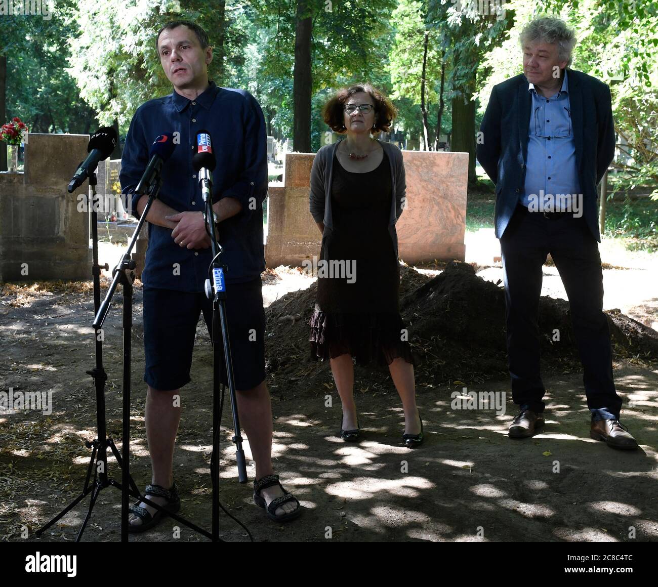 Archaeologists finished exploring with a probe a mass grave of anti-Communist political prisoners at the Prague-Dablice cemetery to find out the exact place where the body of anti-Nazi and anti-Communist fighter Zdena Masinova Sr is buried, Jan Havrda (from left), Prague councillor Milena Johnova and antropologist Petr Veleminsky told on a news conference today, on Thursday, July 23, 2020. Her bodily remains are not found. In March, Prague agreed with Zdena Masinova Jr. that the body of her mother would be exhumed. Masinova Sr (1907-1956) was the wife of a hero of the anti-Nazi resistance move Stock Photo