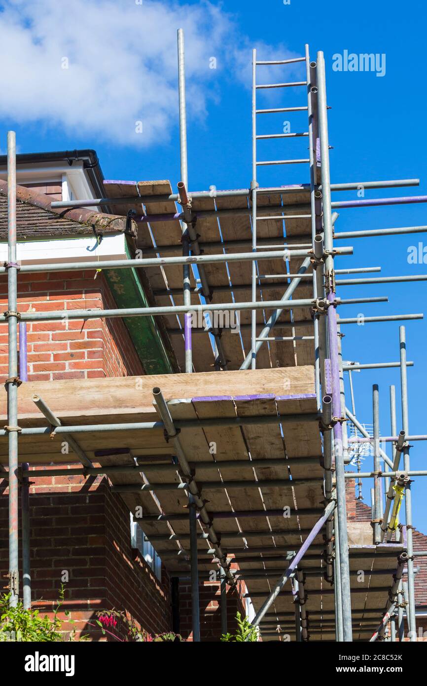 Tubular scaffolding erected around house to carry out repair work at