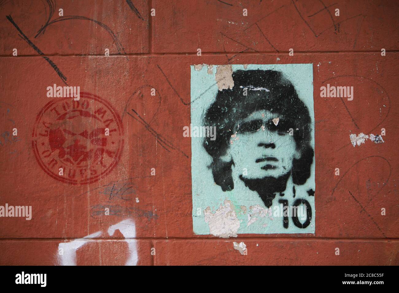 Stencil of football player Diego Armando Maradona on a Buenos Aires street wall. Stock Photo