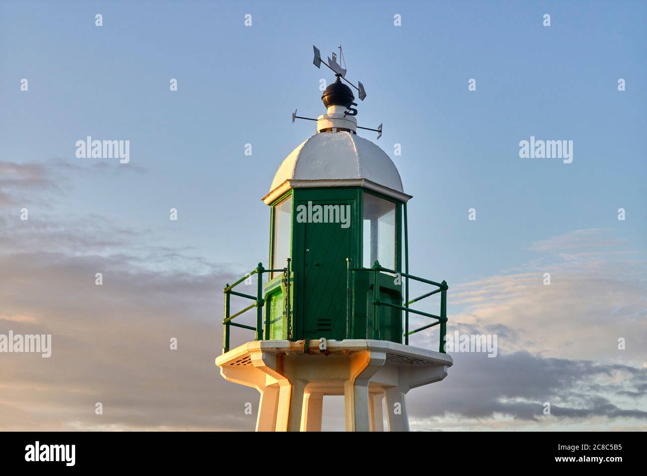 Looking up to lighthouse with weather vane on top at Port Erin, Isle of