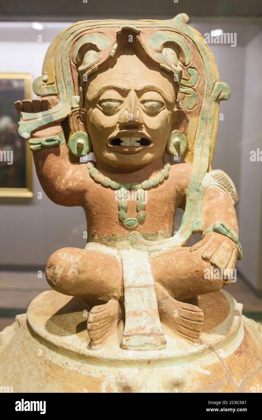 Madrid, Spain - Jul 11th, 2020:  Funerary Urn depicting  solar God Kinich Ahau. Detail. Museum of the Americas, Madrid, Spain Stock Photo