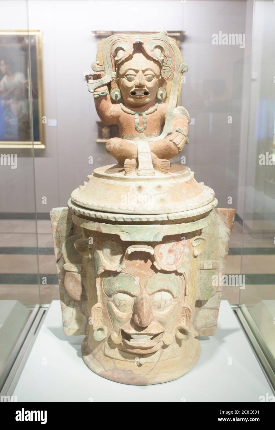 Madrid, Spain - Jul 11th, 2020:  Funerary Urn depicting  solar God Kinich Ahau. Museum of the Americas, Madrid, Spain Stock Photo