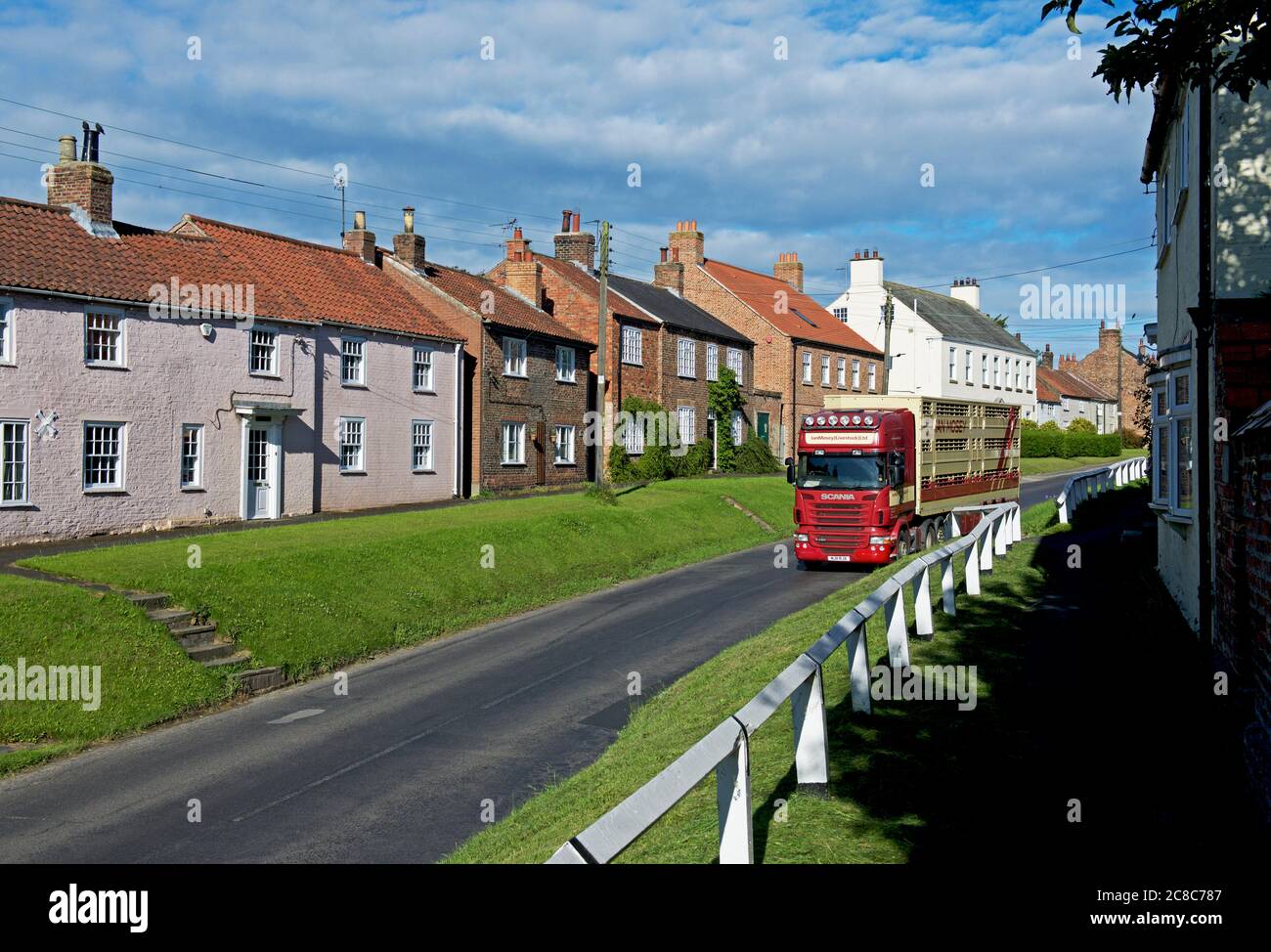 Lorry carrying livestock through the village of Stillington, North Yorkshire, England UK Stock Photo