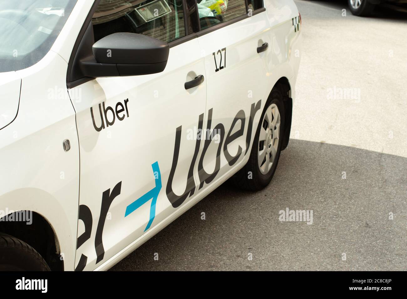Moscow, Russia - 1 June 2020: Uber app taxi on street with logo , Illustrative Editorial Stock Photo