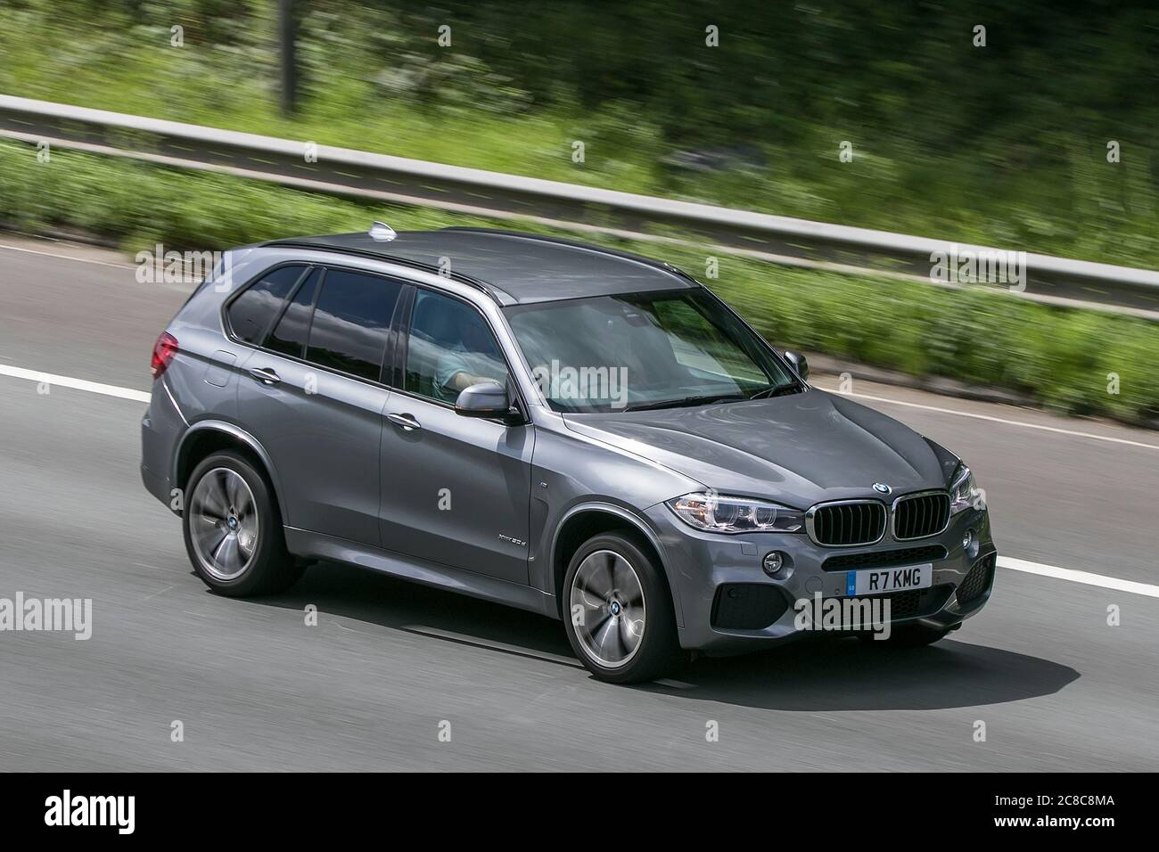 A 2015 R7KMG BMW X5 Xdrive30d M Sport Auto Grey Car SUV Diesel driving on the M6motorway near Preston in Lancashire, UK Stock Photo