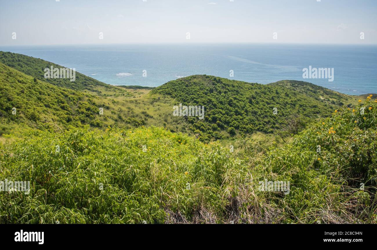 Elevated View Over The Caribbean Sea Coastline With Rolling Hills From