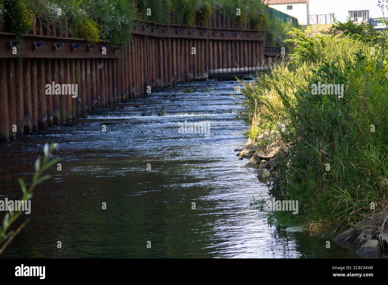 Here a fish ladder aid next to a hydroelectric power station. This allows fish to migrate upstream. Stock Photo