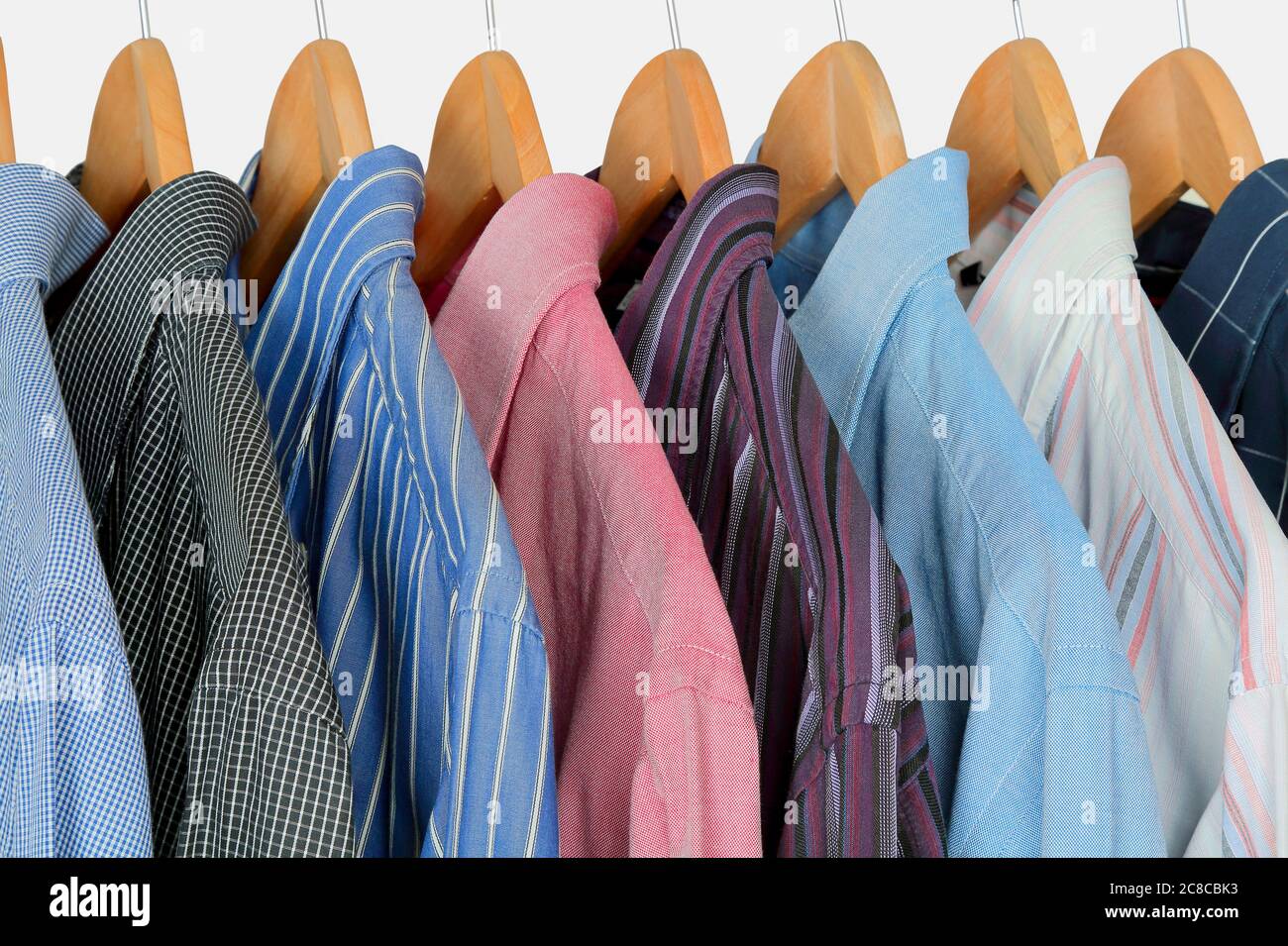 https://c8.alamy.com/comp/2C8CBK3/variety-of-shirts-on-hangers-2C8CBK3.jpg