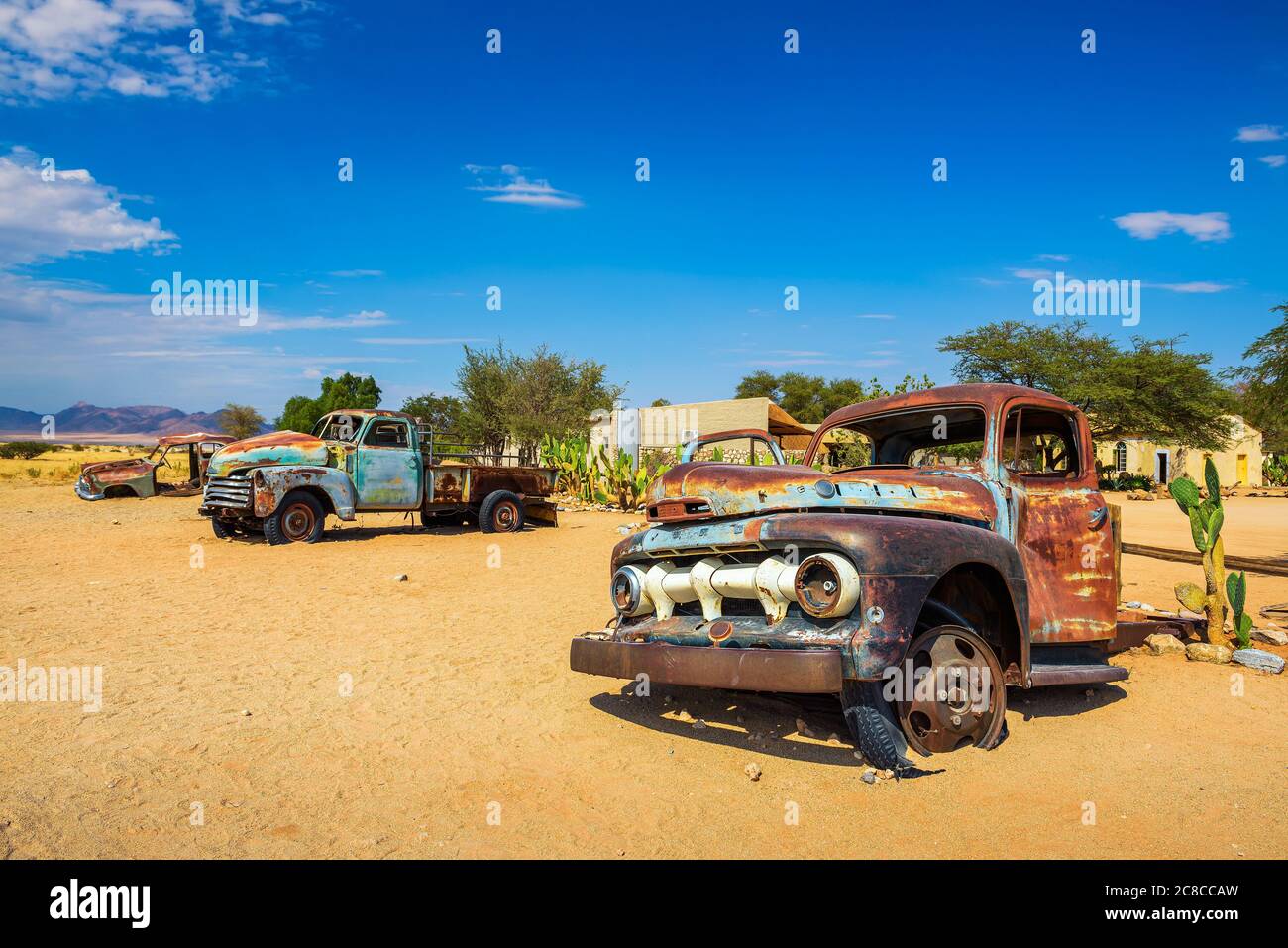 Solitaire, Namibia - March 29, 2019 : Abandoned car wrecks near the Solitaire service station located in the Namib Desert of Namibia. Stock Photo