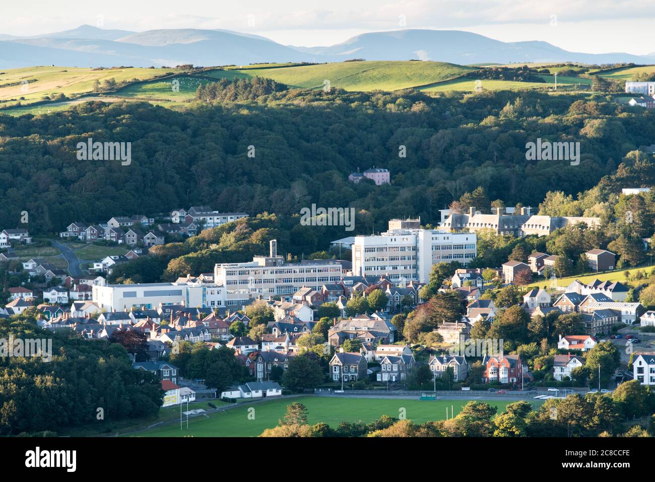 Bronglais General Hospital Aberystwyth, a landscape photograph showing the whole of the hospital from a high viewpoint in summertime. Stock Photo