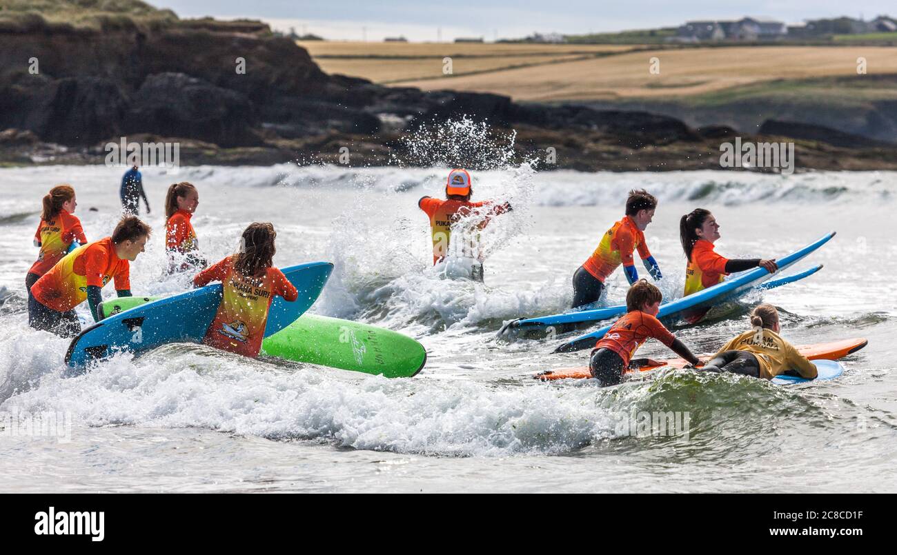 Garrettstown, Cork, Ireland. 23rd July, 2020. Pupils of the Pukana Surf School take to the water for the first time during their summer camp at Garrettstown, Co. Cork, Ireland. - Credit; David Creedon / Alamy Live News Stock Photo