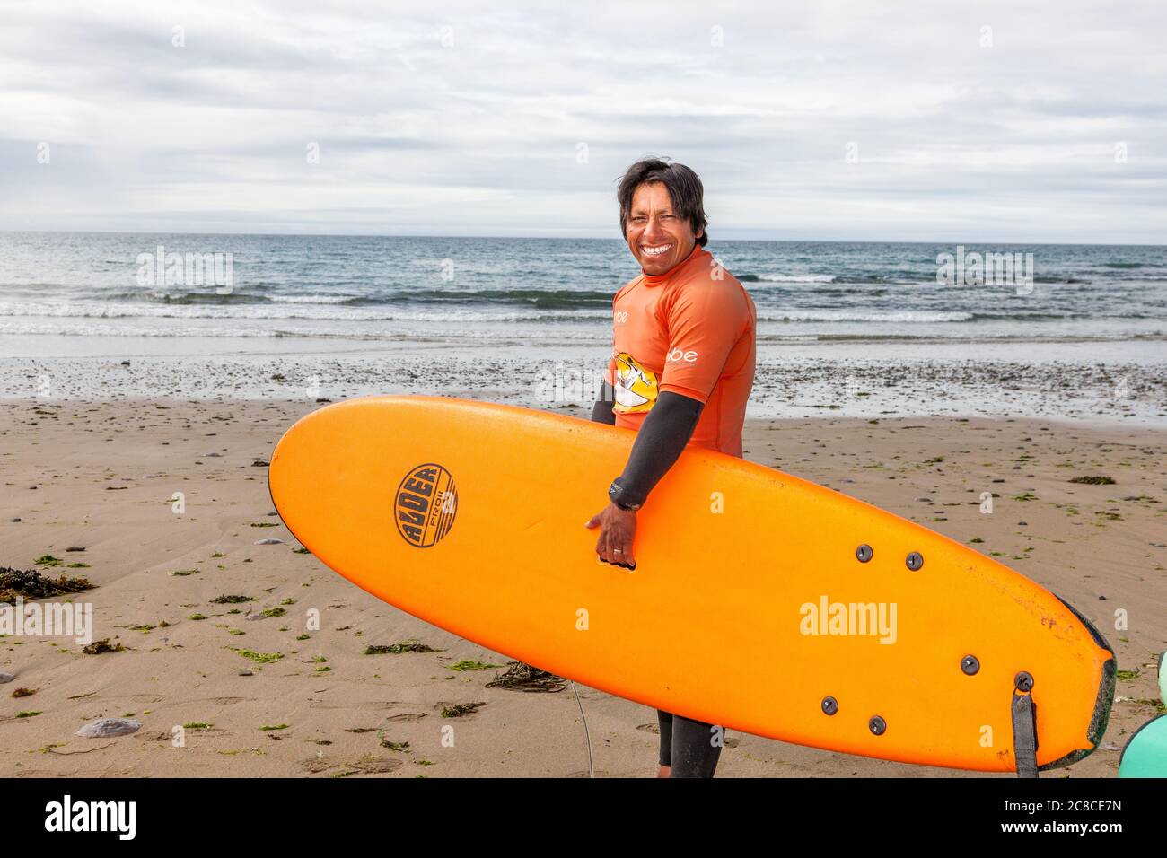 Garrettstown, Cork, Ireland. 23rd July, 2020.Carlos Amaya instructor at the Pukana Surf School preparing for his summer camp class at Garrettstown Beach, Co. Cork, Ireland.  - Credit; David Creedon / Alamy Live News Stock Photo