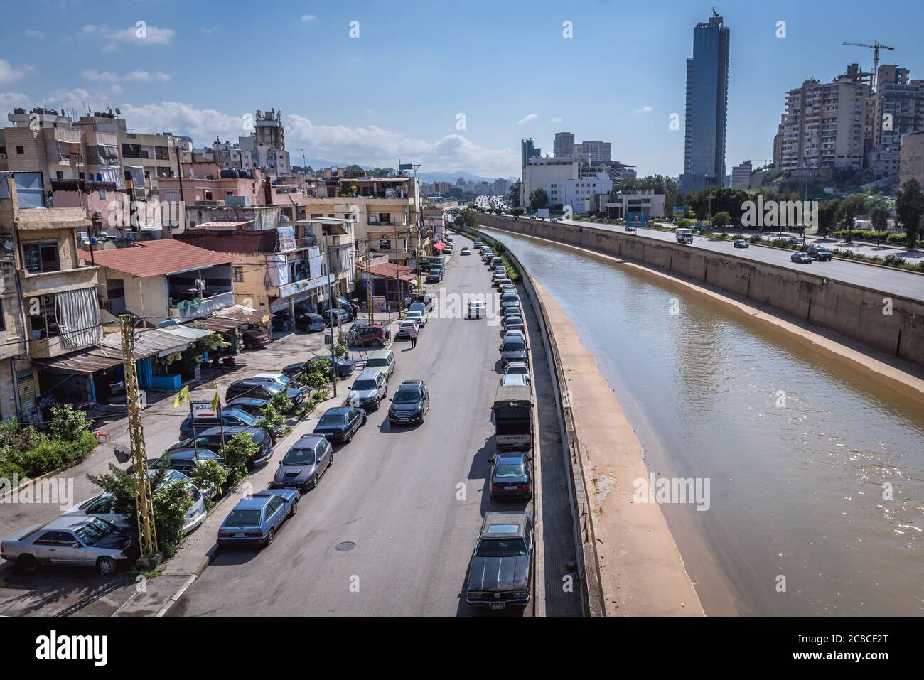 View from Yerevan bridge over Beirut River between Beirut and Sin el Fil suburb and Bourj Hammoud, Lebanon, view with Rive Gauche Tower skyscraper Stock Photo