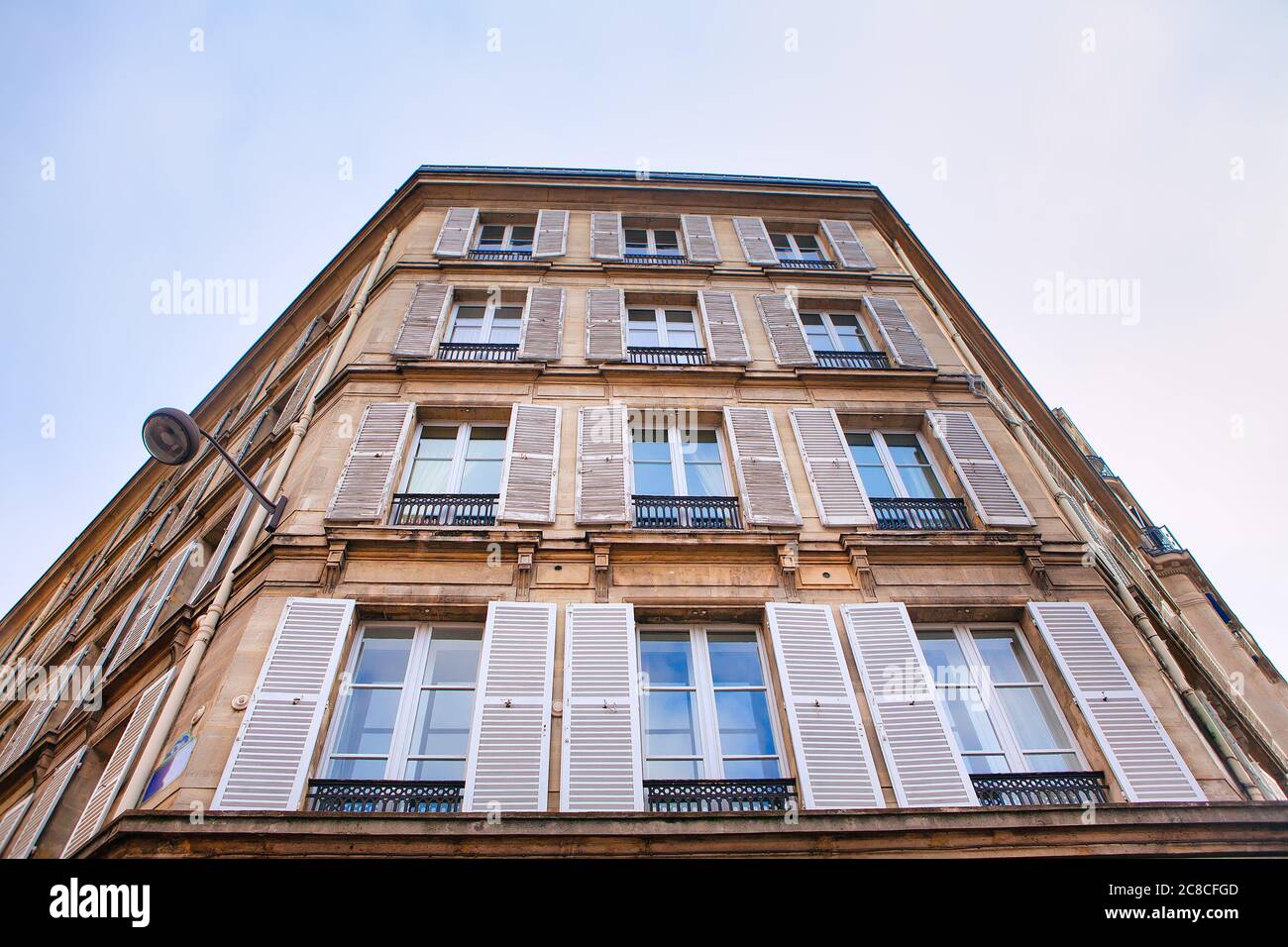 Windows with open shutters view from outside . Residential house in Paris Stock Photo