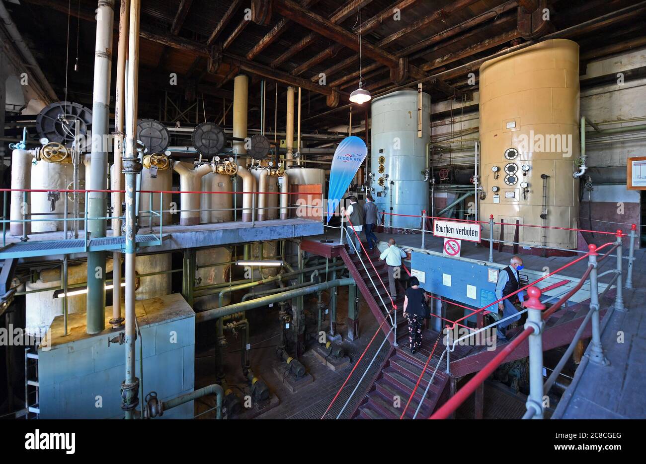 Oldisleben, Germany. 23rd July, 2020. Visitors visit the Oldisleben sugar factory. The beet sugar factory, built in 1872, is completely preserved as an industrial monument. It is a statue of the summer tour of Thuringia's Prime Minister. The motto of the #ThuringiaTour2020 is 'Land & People'. A total of around 30 destinations will be visited from 20 to 30 July. The Minister President wants to get a picture of the situation on site, how people are coping with the Corona crisis. Credit: Martin Schutt/dpa-Zentralbild/dpa/Alamy Live News Stock Photo