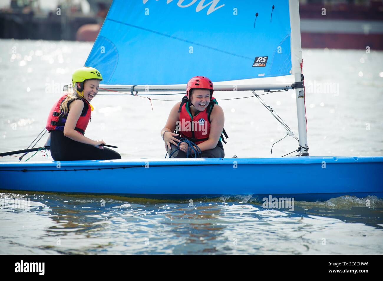 Kids sailing in the Solent. Children learning to sail Quba dinghies in