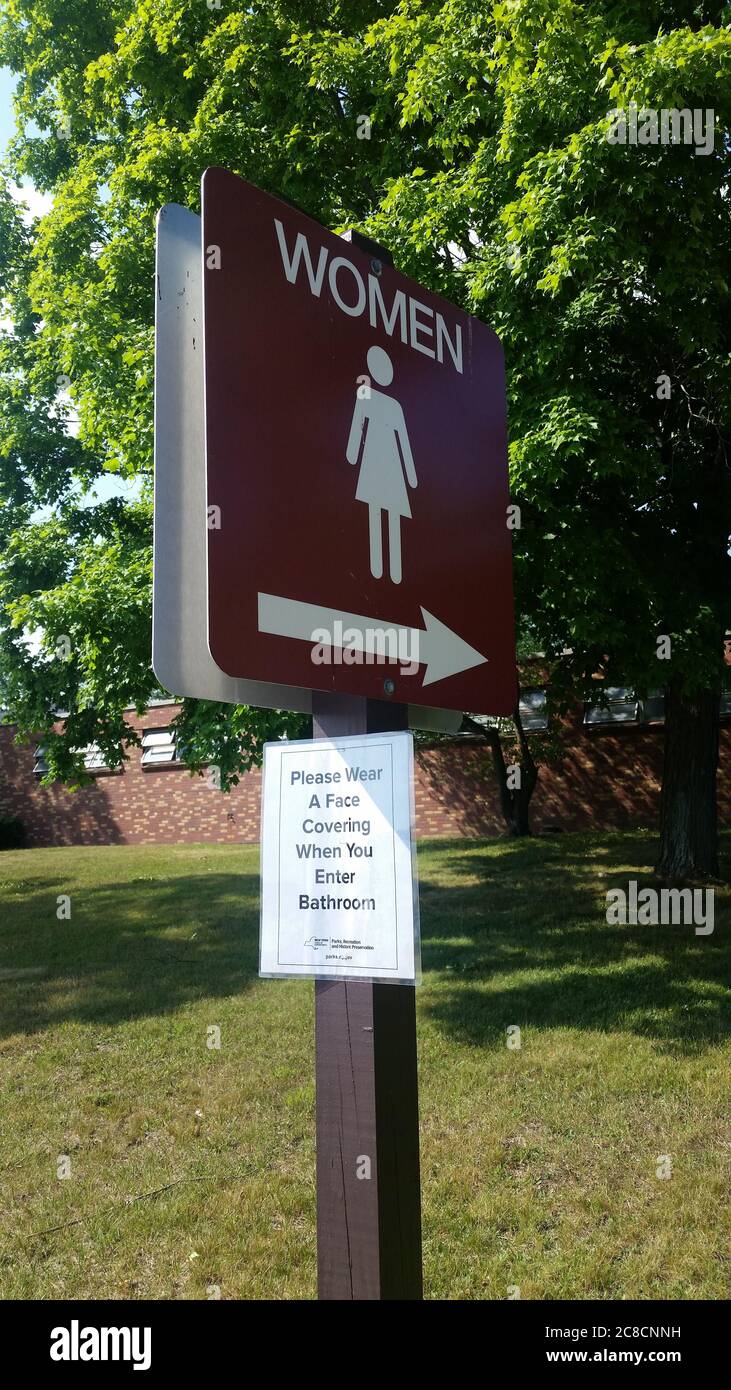 Lake Welch Beach Restroom Bathroom Signs with COVID-19 Social Distancing Rules Stock Photo