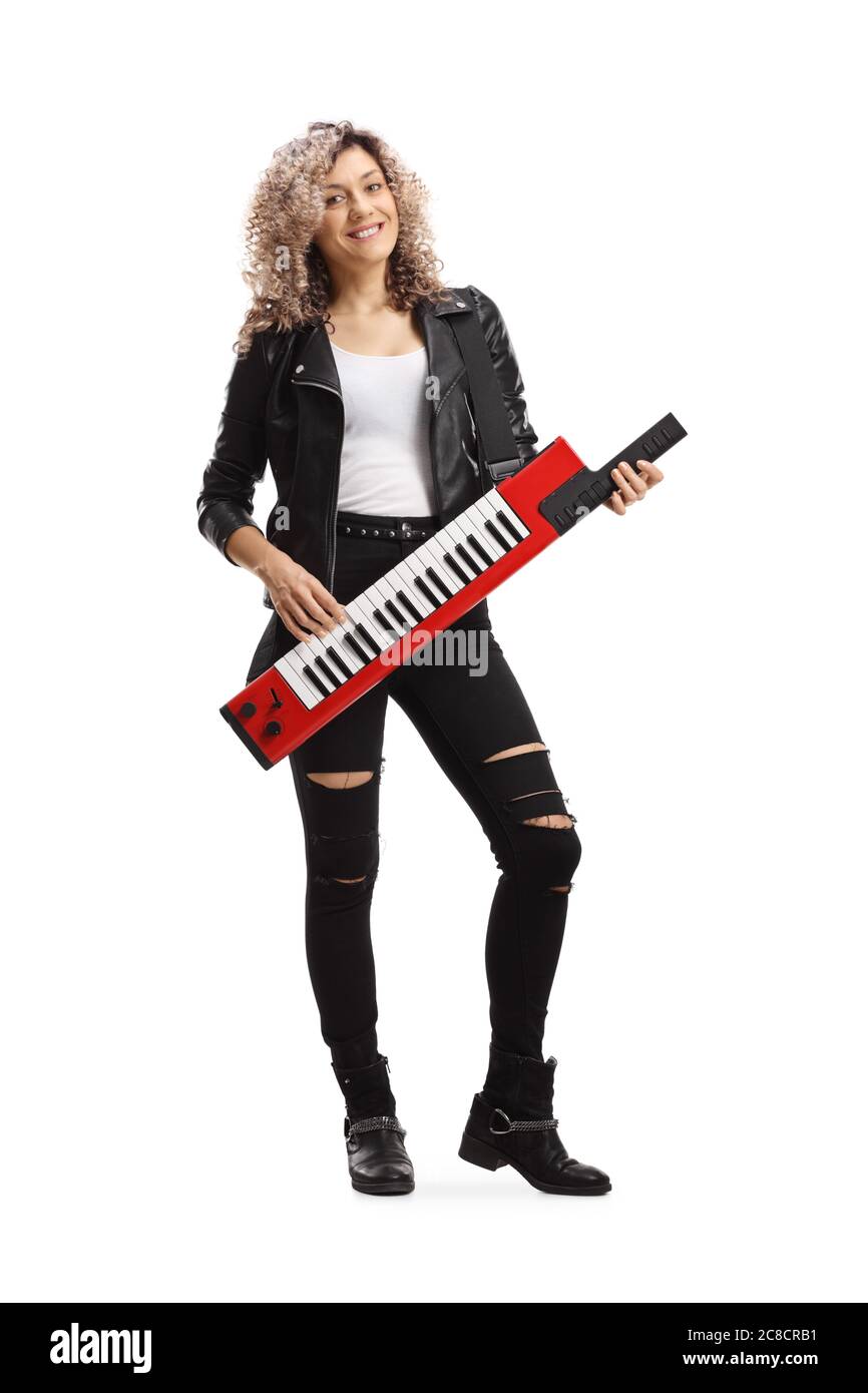 Full length portrait of a young female musician playing a keytar synthesizer isolated on white background Stock Photo