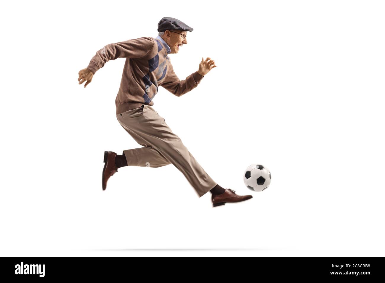 Active elderly man playing football isolated on white background Stock Photo