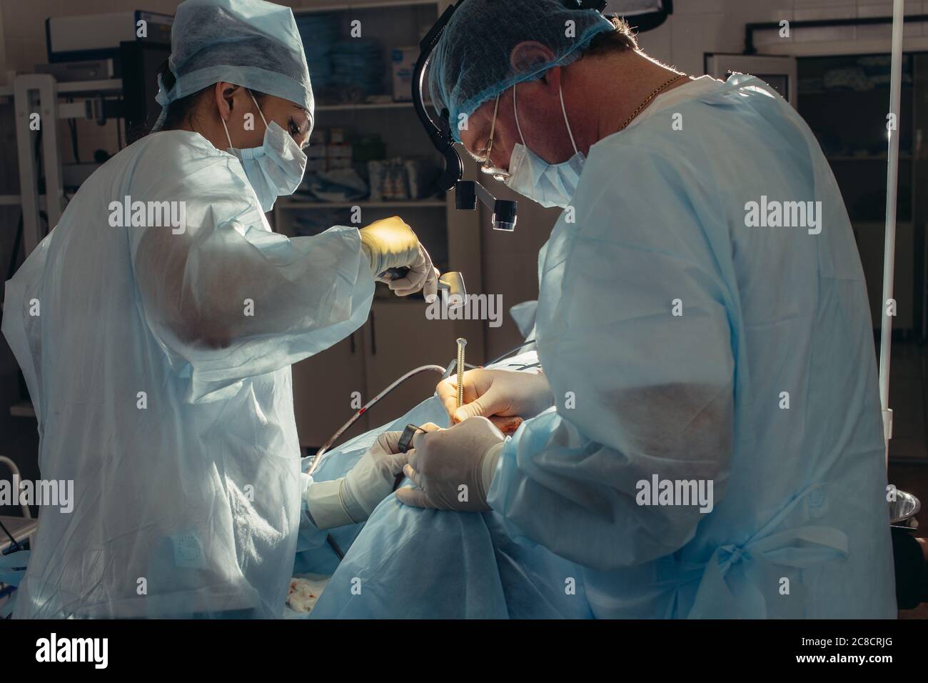 Surgeon uses surgical mallet during the maxillofacial surgery close up