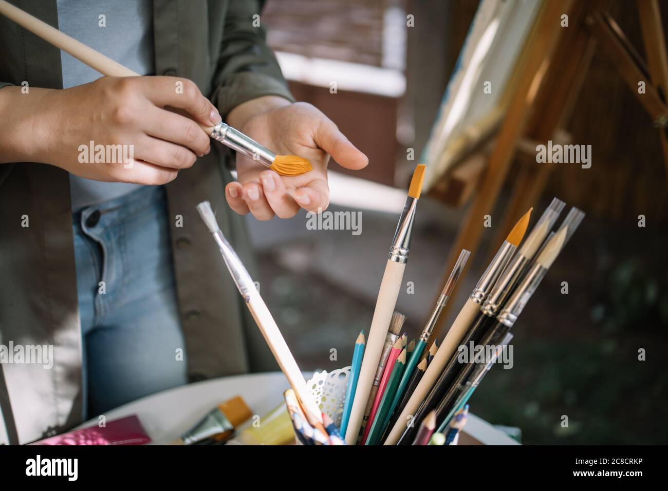 Hand scrubbing paint brush on the other hand outdoor Stock Photo Alamy