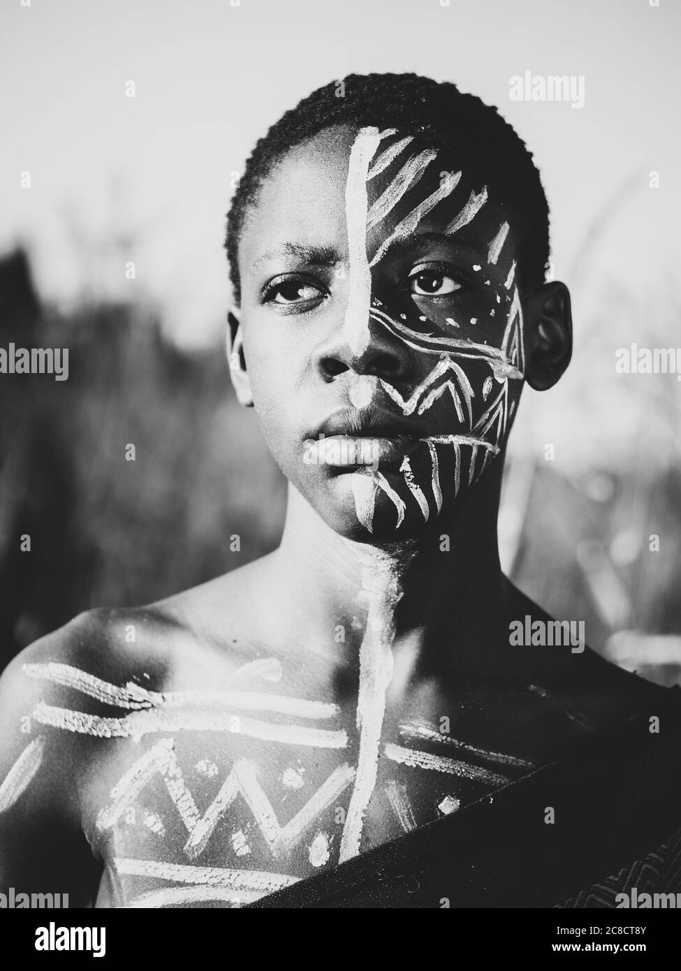 Dark Man With White Face Paint Stock Photo - Download Image Now