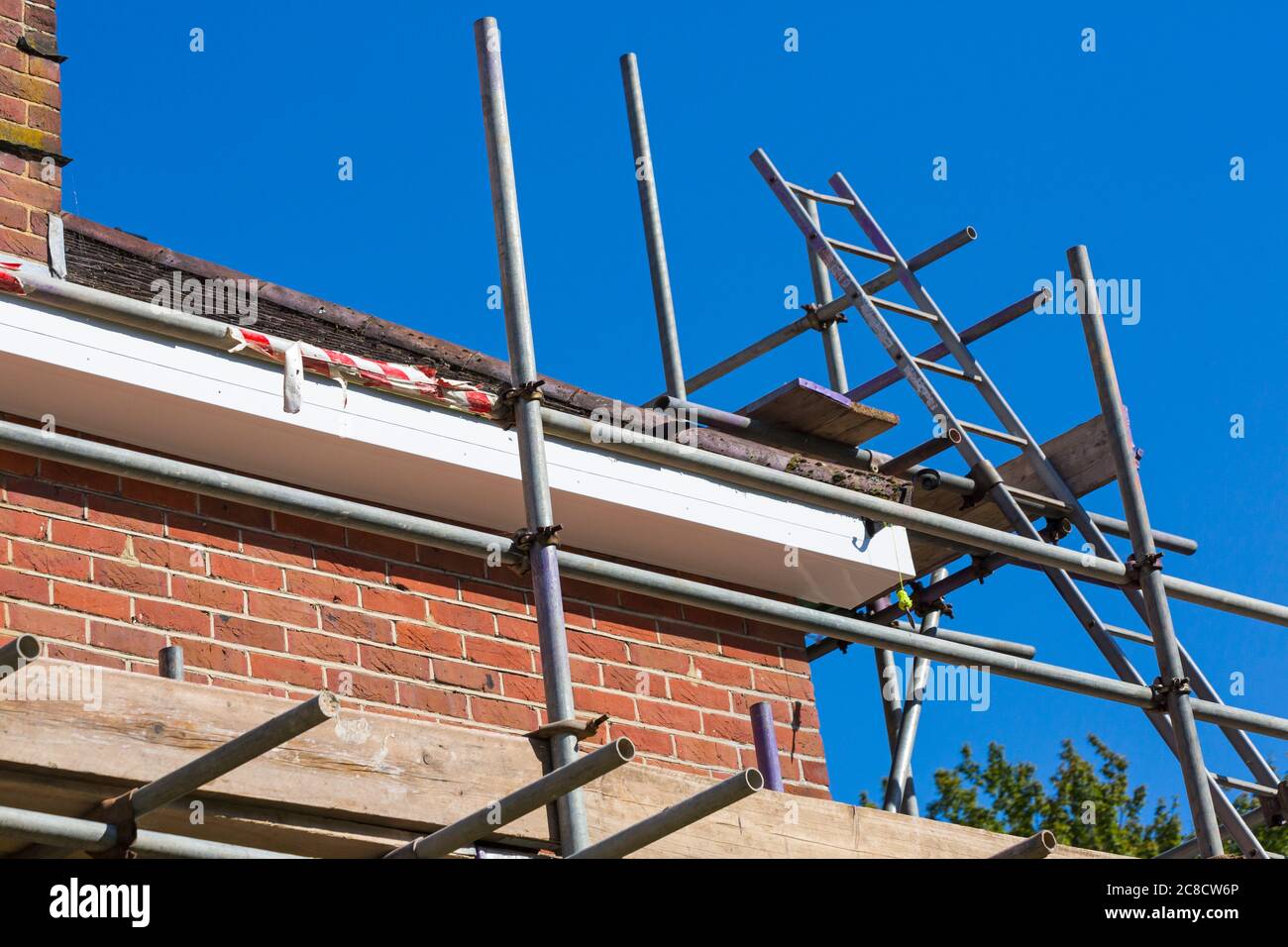 Tubular scaffolding erected around house to carry out repair work at