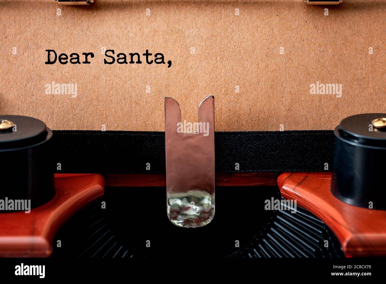 Merry Christmas, old fashioned wish list and Sending a letter to Santa Claus conceptual idea with close up on vintage typewriter and the printed heade Stock Photo
