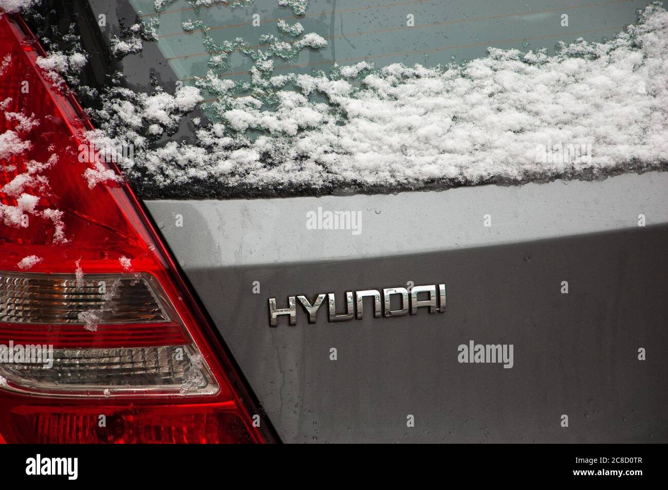 PARIS, FRANCE - FEBRUARY 5, 2018: Hyundai car under snow in rare snowy day in winter in Paris. Hyundai Motor Company, a South Korean multinational veh Stock Photo