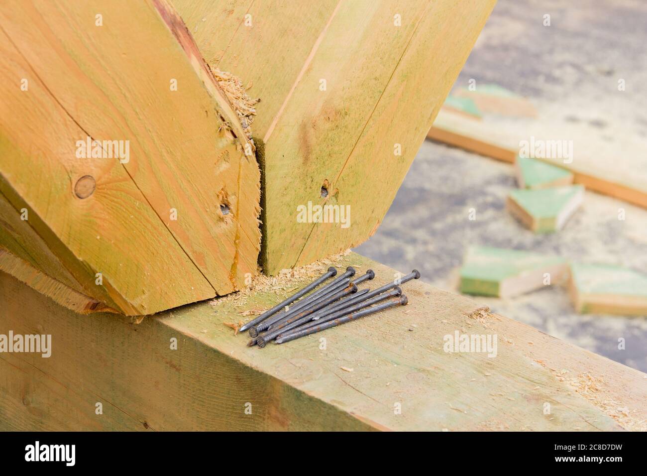 Construction nails during the construction of a wooden house. Building accessories nails Stock Photo