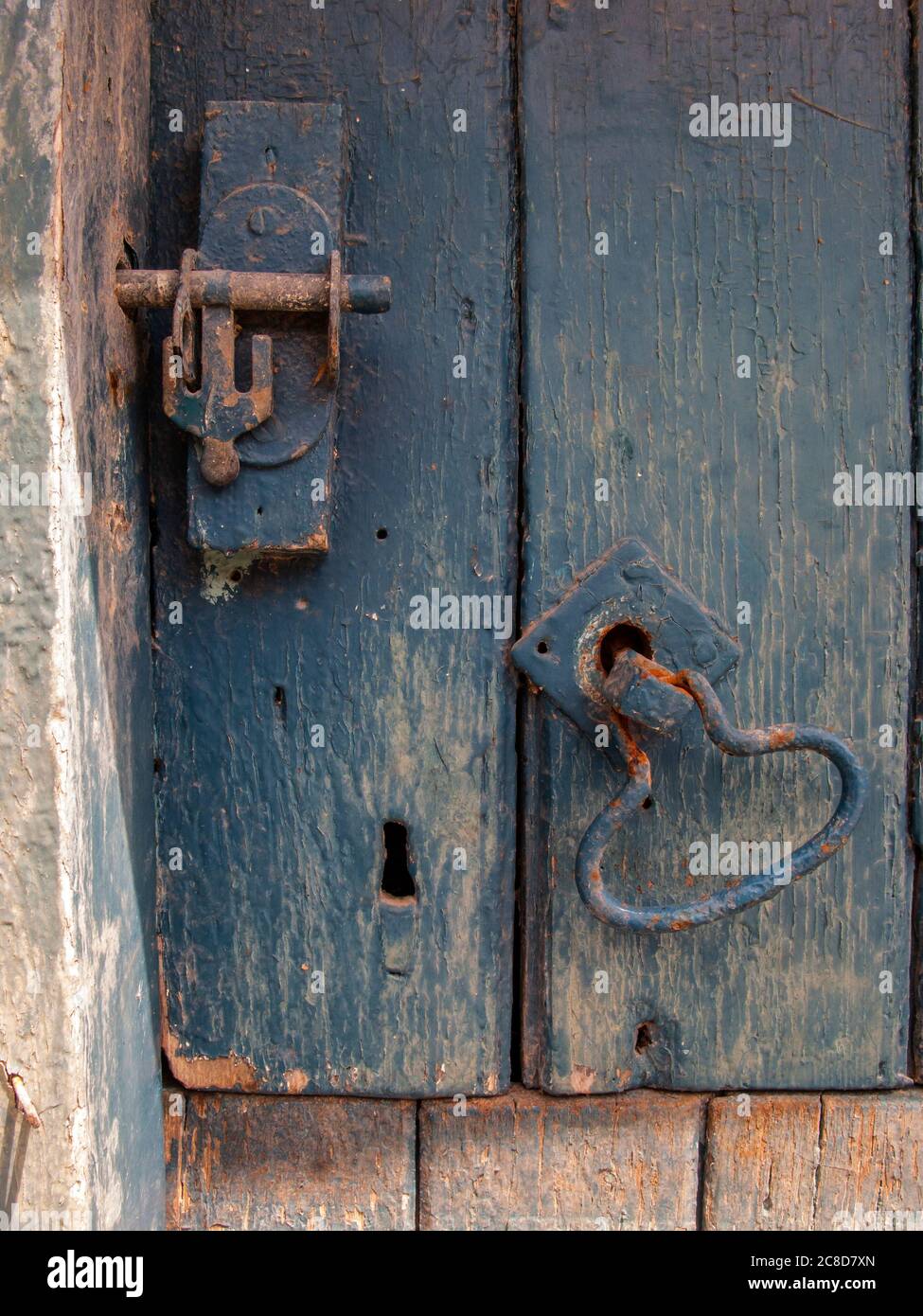 Old Stable Door with fittings and fastenings close-up Stock Photo