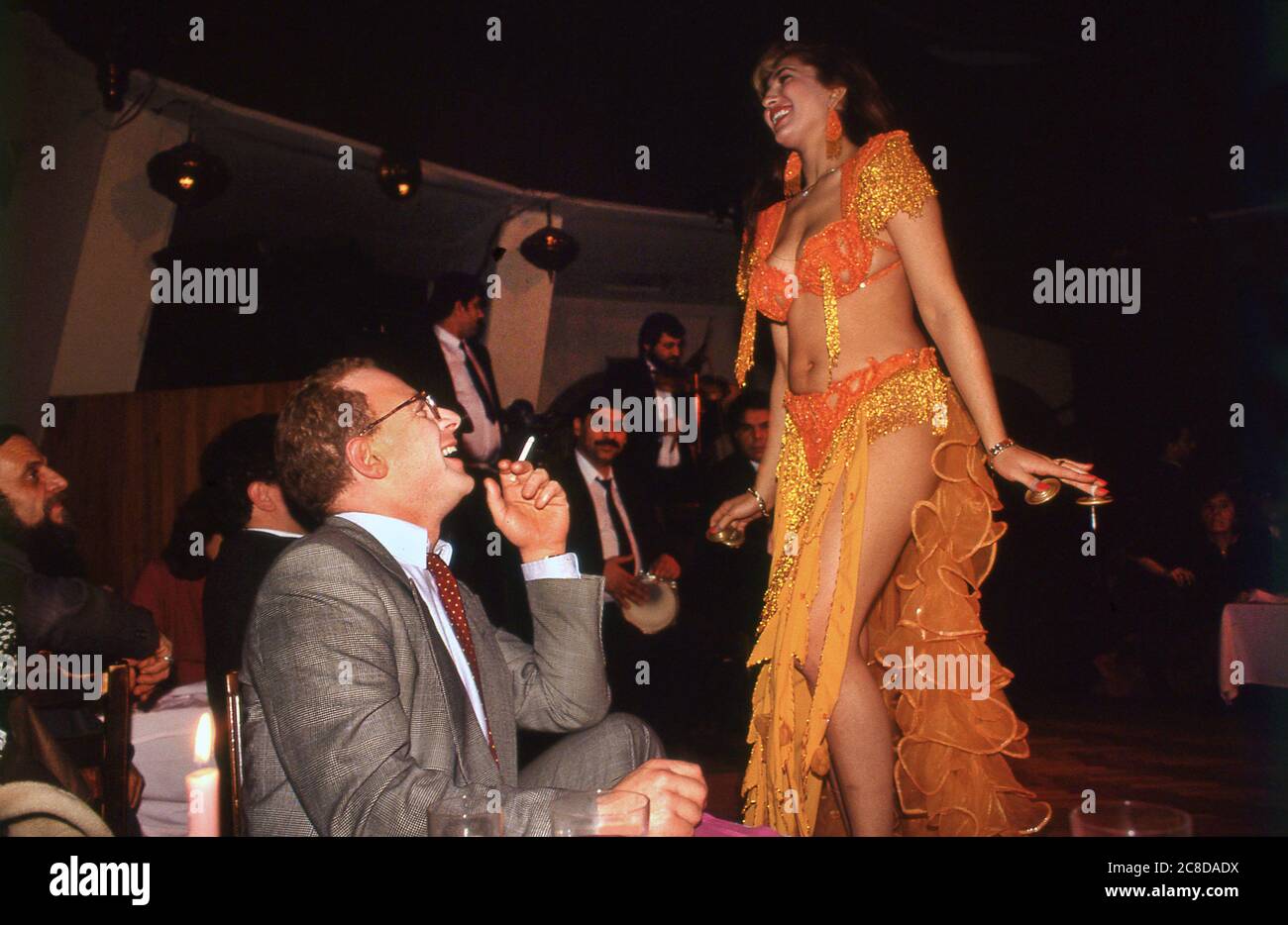 British Journalist and Author John Diamond on a weekend visit to Istanbul  Turkey 1989 Visit to nightclub with Turkish belly dancers Stock Photo -  Alamy
