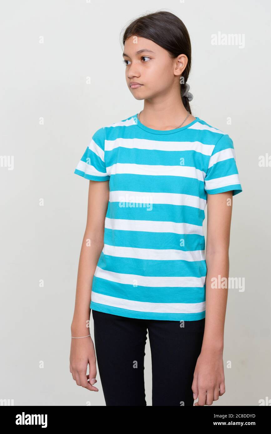 Portrait of young Asian teenage girl against white background Stock ...