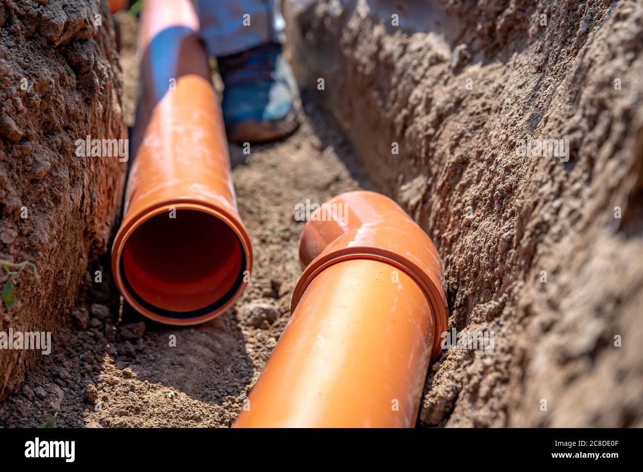 laying drainage pipes into the ground Stock Photo Alamy
