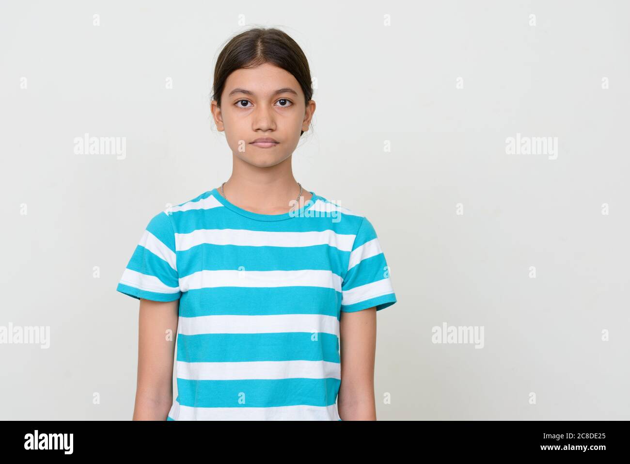 Portrait of young Asian teenage girl against white background Stock ...