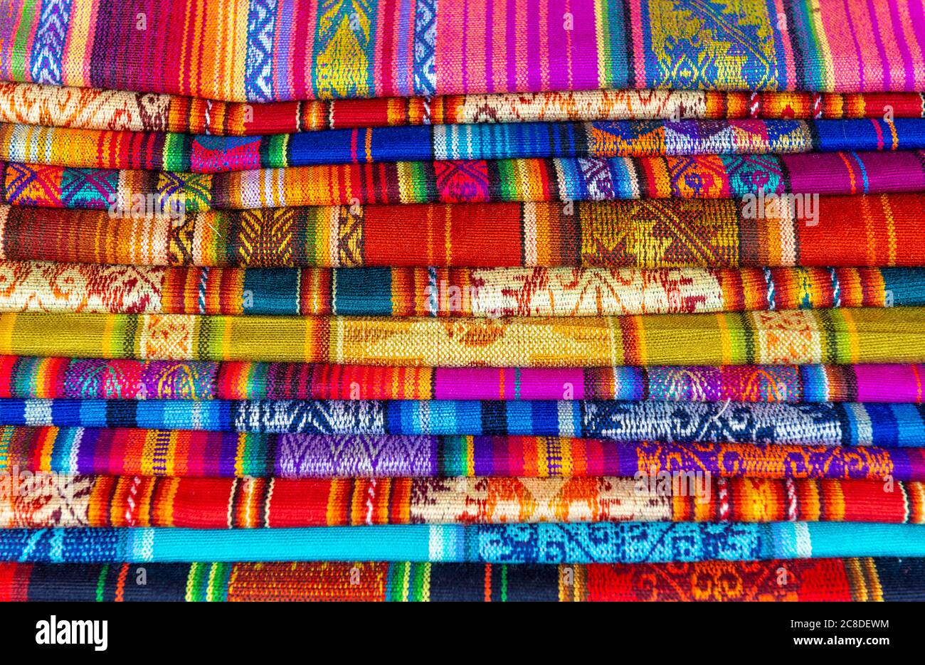 A pile of Andes fabric on the handicraft market of Cusco, Peru. Stock Photo